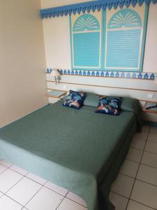 Letto o letti in una camera di Studio CRISTAL COCO Martinique