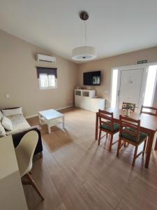a living room with a couch and a table at Can Costals Cerezo in Pals