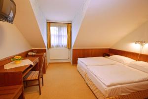 Posteľ alebo postele v izbe v ubytovaní Hotel Floret