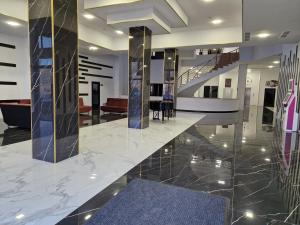 a lobby with a marble floor and stairs at Alvina Complex Tsaghkadzor in Tsaghkadzor
