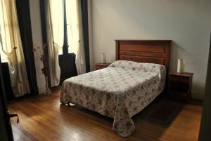 A bed or beds in a room at Arrabal Porteño