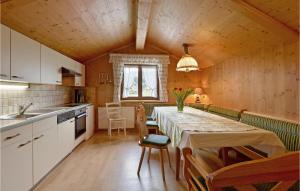 a kitchen with a table and chairs in a room at Stunning Home In Sll With Wifi in Söll