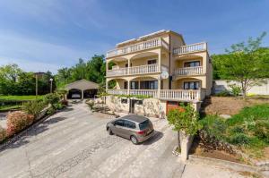 a car parked in front of a building at Two-Bedroom Apartment Crikvenica near Sea 6 in Dramalj