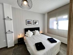 Łóżko lub łóżka w pokoju w obiekcie Loft moderno en buena ubicación