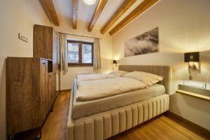 Postel nebo postele na pokoji v ubytování Vlčí Stopa Apartments