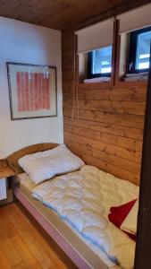 Postel nebo postele na pokoji v ubytování Sonnleitn 48 Nassfeld Apartement
