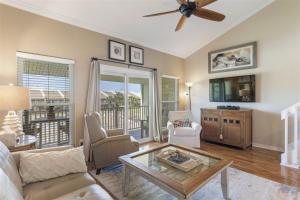 a living room with a couch and a table at 8 G Two Bedroom Condo in Destin