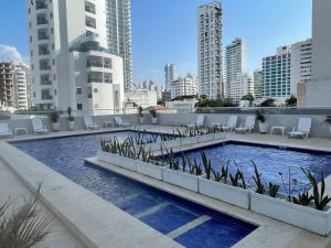 a swimming pool on the roof of a building at Delfin 207 in Cartagena de Indias