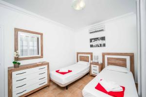 Łóżko lub łóżka w pokoju w obiekcie Villa Fula