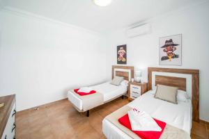Łóżko lub łóżka w pokoju w obiekcie Villa Fula
