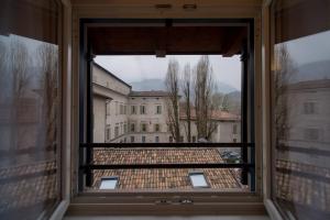 a large window with a view of a building at La Casa di Trento in Trento