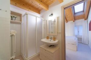 a bathroom with a sink and a mirror at La Casa di Trento in Trento