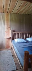 Posteľ alebo postele v izbe v ubytovaní Cabanes des Landes- cabane sur pilotis