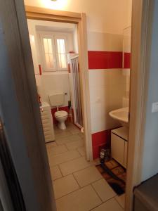 a small bathroom with a toilet and a sink at Cinecasa di Andrea e Cristina in Turin