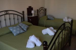 Postel nebo postele na pokoji v ubytování Su Fassoi Cabras