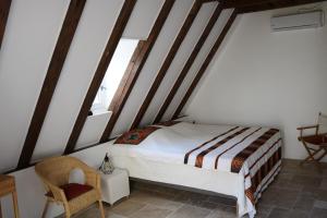 Postel nebo postele na pokoji v ubytování Oltarcie - Maison d'hôte avec piscine
