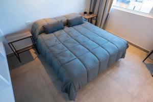 Portales de la Patagonia Apartments客房内的一张或多张床位
