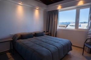 Portales de la Patagonia Apartments客房内的一张或多张床位