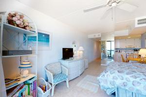 a bedroom with a bed and a living room at Golden Sands 714 in Ocean City