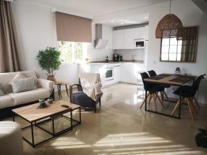 a living room and kitchen with a couch and a table at Costa del sol, Marina del Mar in Mijas Costa