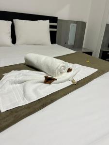 Łóżko lub łóżka w pokoju w obiekcie Villa Brilho do Sol