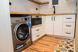 a kitchen with a washing machine in a kitchen at Sunny Lakes Resort , Revira Apartment in Sharm El Sheikh