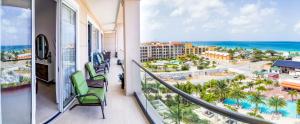 a balcony with a view of the beach and the ocean at Ocean View Penthouse in Palm-Eagle Beach