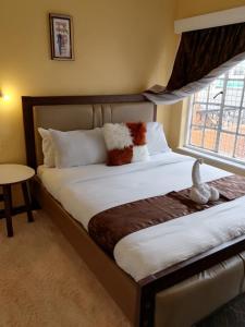 Ένα ή περισσότερα κρεβάτια σε δωμάτιο στο Nash Issah homes - 2bedroom
