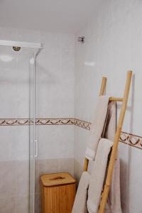 a towel rack in a bathroom with a shower at Casa Mahalo - Modern Apartment with Pool, Minutes from Spectacular Beaches in Parque Holandes