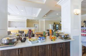 a kitchen with a counter with food on it at Best Western New Orleans East in New Orleans