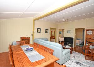 a living room with a couch and a table at Torquay Treasure in Torquay