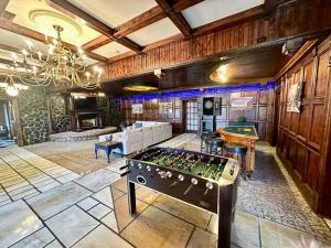 a large room with a pool table and a gaming room at 5 Bedroom Estate near Casino and downtown in Bristol