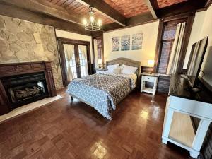 a bedroom with a bed and a fireplace at 5 Bedroom Estate near Casino and downtown in Bristol