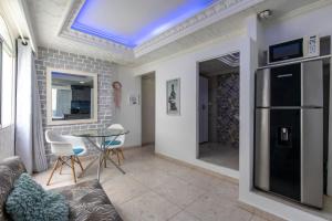 a living room with a couch and a table at APARTASUITES CON VISTA AL MAR in Cartagena de Indias