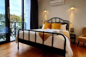 Ένα ή περισσότερα κρεβάτια σε δωμάτιο στο Flagstaff Hill West Melbourne +18 φωτογραφίες