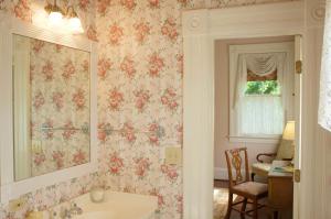a bathroom with a sink and a mirror at Lookaway Inn in North Augusta