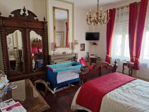 Кровать или кровати в номере B & B Les Secrets des Loges