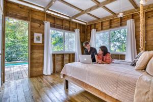 A bed or beds in a room at Monkey Tiny House - Private swimming pool