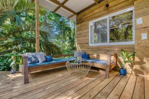 A seating area at Monkey Tiny House - Private swimming pool