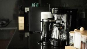 a coffee maker sitting on a counter in a kitchen at AA GUESTHOUSE in Canggu