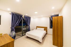Voodi või voodid majutusasutuse Đà Lạt Cao Nguyên Hotel toas