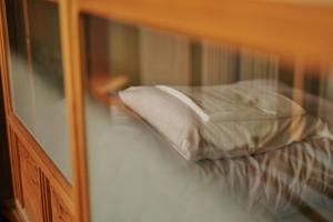 Postel nebo postele na pokoji v ubytování 目の前が吉野川・雨天でも屋外体験ができる絶景の一軒家