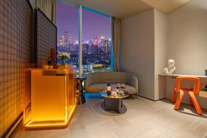 a hotel room with a view of a city at The Clouds Apartment in Shenzhen
