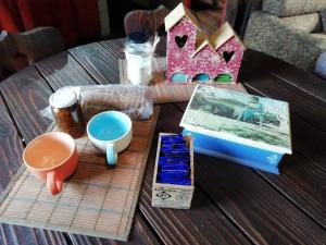 a table with some items on top of a table at La Casa de Colores in Garuhapé