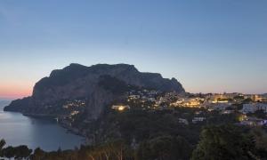 a view of the amalfi coast at night at Villa Mariuccia Capri in Capri