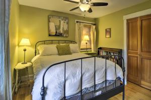 a bedroom with a bed and a ceiling fan at Bainbridge Island Abode Less Than 1 Mi to Winslow! in Winslow