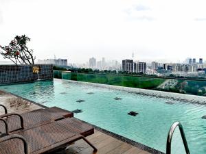 a swimming pool on top of a building at Petalz Luxury Suite 10Pax MID VALLEY OLD KLANG ROAD OUG KLANG LAMA KL in Kuala Lumpur