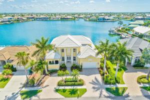 an aerial view of a house with a body of water at 123 Landmark Street in Marco Island