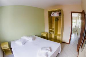 Cama o camas de una habitación en Apartamentos Praia Campeche 50m do mar