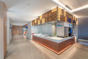 a long hallway with a kitchen in a building at Holiday Inn Express Lanzhou Jianlan, an IHG Hotel in Lanzhou